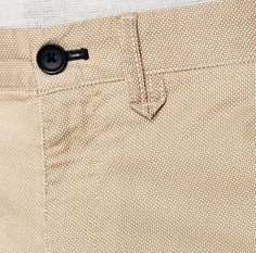 a close up view of the bottom of a pair of pants with buttons on them