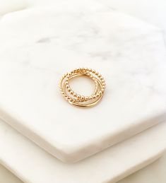 "A curated set of simple gold bands to elevate your ring stack. Handmade in high-quality 14k gold fill so you never have to take them off. ＤＥＴＡＩＬＳ: Select your combination from the drop-down menu (see last photo above for labeled styles) 14k Gold Filled - tarnish-proof / water-proof 2 mm width bands ( 14 gauge) ＳＩＺＩＮＧ: Handmade to order in your size Select your ring size on the drop down menu (True to size) ABOUT GOLD FILL: When buying jewelry, quality is everything. Invest a little more in your Everyday Simple Stackable Rings In 14k Gold Filled, Everyday Simple 14k Gold Filled Stackable Rings, Dainty Hypoallergenic 14k Gold Filled Rings, Hypoallergenic 14k Gold Stackable Rings For Everyday, Everyday Hypoallergenic Stackable Rings In 14k Gold Filled, Hypoallergenic Dainty 14k Gold Filled Rings, Everyday Hypoallergenic 14k Gold Stackable Rings, 14k Gold Filled Everyday Toe Rings, Delicate 14k Gold Filled Stackable Promise Rings