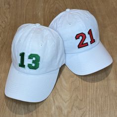 The Kids Biggest Fan Hat is the perfect addition to any game day outfit for your littles! Get it customized with your team's colors and your player's number. THIS IS A YOUTH SIZE HAT. If you are looking for the adult version and don't see it in the shop feel free to message me.  HOW TO ORDER: Pick a color for your number AND a color for the number outline. Choose a white or black felt backing (this is not the hat color, it is the backing the number is embroidered onto for the patch). Then list what number you would like on your hat.  See picture with colors for the corresponding numbers. EX. - 16 for number, 12 for outline. OR 9 for number and outline. Please let me know if you have any questions and I will help make sure you get what you are looking for, I am always here to help! The numb White Baseball Cap For Birthday, One Size Fits Most, White Baseball Cap For Birthday, One Size, White Baseball Cap For Birthday, White Fitted Hat For Baseball Season Game Day, White Fitted Hat For Baseball Game Day, White Sports Fan Hat One Size Fits Most, White Sports Fan Hat, One Size Fits Most, White Baseball Cap For Game Day, White Baseball Cap With Curved Brim For Game Day