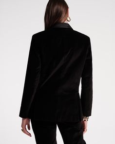 Crafted with a luxurious velvet fabric, the new Tuxedo Jacket is an instant classic. Redefine modern elegance with this tailored silhouette that effortlessly sculpts for a luxurious look. Featuring a satin lapel, slit chest pocket, and satin-covered buttons, the cozy frocks are perfect for your upcoming festivities. Lined velvet tuxedo jacket Left chest patch pocket, 2 front waist patch pockets Satin lapel 2 satin-covered front buttons Shell: 98% Cotton, 2% Spandex Lining: 100% Polyester Made in Velvet Tuxedo Jacket, Velvet Tuxedo, Tuxedo Jacket, Stretch Velvet, Handbag Shoes, Sweater Coats, Modern Elegance, New Handbags, Covered Buttons