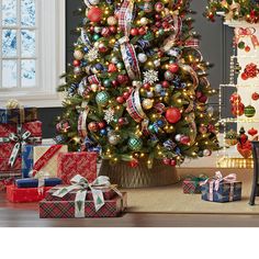 a decorated christmas tree with presents under it