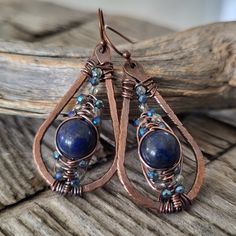 Sparkle Beaded Dangle Earrings -handcrafted unique design with a bohemian feel -made of solid patina copper -featuring natural lapis lazui stone,  and blue faceted glass beads for pretty sparkle -woven wire wrap detail -classic teardrop shape -lightweight and comfortable for everyday wear or that special occasion -great gift idea for the woman who loves artisan jewelry -copper plated brass ear hooks - nickel free, lead free and cadmium free Size:  2 inches long (measurement includes the ear hook Bohemian Wire Wrapped Teardrop Jewelry, Bohemian Teardrop Wire Wrapped Jewelry, Adjustable Teardrop Bohemian Wrap Earrings, Bohemian Teardrop Wrap Earrings, Handmade Bohemian Copper Wire Jewelry, Bohemian Wire Wrapped Earrings For Jewelry Making, Handmade Unique Copper Wire Earrings, Bohemian Wire Wrapped Jewelry In Copper, Artisan Handmade Wrap Drop Earrings