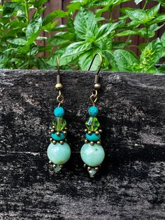 Earrings Made with Turquoise, Green Beads and Antique Brass Bohemian Green Handmade Crystal Earrings, Handmade Bohemian Green Crystal Earrings, Turquoise Czech Glass Beaded Earrings, Turquoise Earrings With Colorful Czech Glass Beads, Jade Beaded Earrings For Jewelry Making, Turquoise Earrings With Colorful Round Beads, Bohemian Jade Earrings, Bohemian Jade Earrings With Ear Wire, Bohemian Turquoise Czech Glass Beaded Earrings