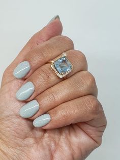 A mesmerizing emerald-cut aquamarine ring, a true masterpiece adorned with authentic diamonds. This captivating piece can be crafted in either 18k Yellow Gold or 14k Yellow Gold, offering a touch of luxury and timeless elegance. The aquamarine, with its serene blue hue, captures the essence of tranquil waters, while the surrounding diamonds add a radiant sparkle, enhancing its beauty. Whether you choose 18k or 14k, this ring promises to be a stunning addition to any jewelry collection, perfect f Emerald Cut Aquamarine Ring, Emerald Cut Ring, Emerald Cut Rings, Aquamarine Ring, Aquamarine Rings, Emerald Cut Diamonds, Jewelry Earrings Hoops, Emerald Cut, Promise Rings