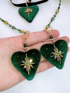 Handmade beaded emerald heart shaped velvet jewelry set: earrings and necklace. You may choose 2 variations: velvet choker or beautiful sparkling beads on the neck. Or both for any events! Velvet heart pendant and earrings embroidered with shiny crystal and rhinestone beads! Each element sewd by hands.Velvet choker with stainless steel chain. This is unique high quality hand work. It will be a wonderful gift! Perfect Valentines day gift! It will compare for different clothes and moments. !!!!Loo Heart Jewelry Set, Unique Valentines Day Gifts, Velvet Heart, Heart Shaped Jewelry, Velvet Jewelry, Set Earrings, Earrings And Necklace, Unique Valentines, Velvet Choker