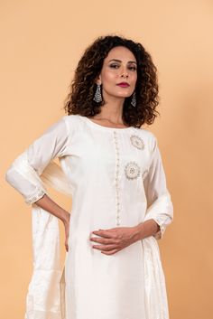 The fabric of this set is silk and it features intricate sequin work. The neckline is a zero-neck design and the 3/4th length sleeves add to its elegance. The set includes a kurta, trousers, and dupatta, making it a total of two components. Festive Cotton Silk Kurta With Set-in Sleeves, Eid Straight Kurta With Set-in Sleeves, Festive Kurta With Set-in Sleeves, Silk Palazzo Set With Mirror Work And Straight Kurta, Elegant Art Silk Sets For Navratri, Traditional Kurta With Set-in Sleeves For Eid, Elegant Designer Cotton Silk Sets, Elegant Cotton Silk Designer Sets, Silk Wedding Sets With Set-in Sleeves