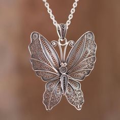 The wings of a beautiful nocturnal butterfly are captured in sterling silver featuring marvelous handcrafted filigree openwork. Nancy Quispe of Peru who designs the necklace works in the hope of opening a school for young artisans. Filigree Silver Jewelry, Filigree Pendant Necklace, Bridesmaid Pearls, Filigree Necklaces, Filigree Jewelry, Goth Jewelry, Silver Jewelry Design, Roman Glass, Filigree Pendant