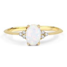 Dainty Opal Ring, Natural White Opal Ring, Stacking Ring, Diamond Ring, 14k Solid Gold Ring, October Birthstone Ring, Oval Cut Opal, Stacking Ring, Solitaire Opal Ring, Promise Ring, Engagement Ring, 14K Solid Gold Natural Oval cut opal stone with both sides 3 real diamonds ring. ITEM DETAILS * Made to Order. * Material: 14K Solid Gold * Material Color Options: Yellow Gold, Rose Gold, White Gold * Band Width: 1.20 MM * Gemstone: Opal * Gemstone Carat: 0.50 CTW * Gemstone Cut: Oval Cut * Side Sto Oval Diamond Moonstone Ring In Yellow Gold, Oval Moonstone Ring With Diamonds In Yellow Gold, Heirloom 14k Gold Opal Ring With Halo, Classic Yellow Gold Halo Opal Ring, Heirloom White Opal Ring Oval Cabochon, Oval Moonstone Ring With Diamond Accents For Gift, Oval Moonstone Ring With Diamond Accents, Fine Jewelry 14k Gold Oval Moonstone Ring, White Birthstone Ring With Prong Setting In 14k Gold