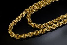 This elaborate Victorian era yellow gold chain necklace was made in the 19th century, circa 1850s-1870s.  The gold of the necklace was tested to be in the 17 to 18 karat range.  Length is 124 cm (48 in.)  Width is 5 mm (3/16 in.)  Weight is 75 grams.  The clasp is a modern replacement. Elegant Yellow Gold Wheat Chain Necklace, Elegant Gold Necklace With Wheat Chain, Elegant Wheat Chain Necklace, Formal Wheat Chain Link Necklace, Classic Long Chain Necklace For Formal Occasions, Vintage Formal Jewelry With Cable Chain, Vintage Jewelry With Oval Link Cable Chain, Formal Wheat Chain Necklace, Formal Round Wheat Chain Necklace