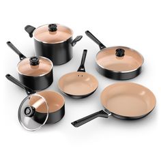 an assortment of pots and pans with lids