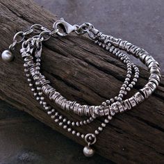 A beaded bracelet handmade of oxidized sterling silver. APPROXIMATE MEASUREMENTS: * Total length: 18 cm/19 cm/20cm/21cm + 3 cm adjustable chain  or  7"/7.5"/8"/8.5" + 1.2" extra chain  * Beaded size (diameter) : ~4 mm  * Metal : 925 sterling silver The bracelet pictured are not the exact ones that you will receive, but it will be the same design. S H I P P I N G : If you need things for special occasions or by a certain date please ensure that you order in plenty of time as the postal system is Rhodonite Bracelet, Modern Geometric Jewelry, Oxidized Silver Bracelet, African Turquoise Bracelet, Multi Chain Bracelet, Raw Stone Earring, Pink Rhodonite, Silver Beaded Bracelet, Sterling Silver Bead Bracelet