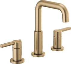 two faucets in brushed brass finish