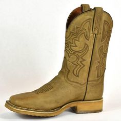 The Dan Post Roper Cowboy Boot- Tan Leather- Cowboy Certified Square Toe is perfect for anyone who wants to have that laidback, casual western look. This Cowboy Certified boot features rugged genuine full-grain tan leather. It features an easy-wearing deep collar square toe design and a removable orthotic insole, giving you all-day comfort when on your feet! The intricate stitching found across this boot makes it not only stylish but also adds personality, so whether you're spending a day on the