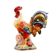 a colorful rooster figurine sitting on top of a table