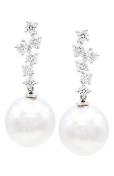 Easy-to-wear drop earrings will add significant polish to even your most casual ensembles. Pearl size: 13–14mm Total diamond weight: 1.05ct. Color: F–G Clarity: SI 14k gold/freshwater pearl/diamond Imported Diamond Guide Pear-shaped Diamond Earrings For Formal Events, Classic Diamond Cluster Earrings For Formal Events, Formal White Gold Pear-shaped Earrings, Formal Pear-shaped White Gold Earrings, Classic Cluster Earrings In Diamond White For Formal Events, Classic Cluster Earrings In Diamond White For Formal Occasions, Classic Diamond White Cluster Earrings For Formal Events, Classic Diamond White Cluster Earrings For Formal Occasions, White Cluster Earrings With Brilliant Cut For Formal Occasions