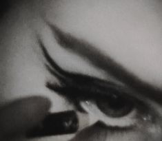 a woman's eye is shown with long lashes