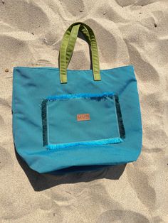 Introducing the Beach Bags Summer Flower Discover the ultimate blend of style, sustainability, and functionality with our Beach Bags Summer Flower. Features: Waterproof Design, Extra Large Size, Interior Pocket, Durable Vegan Leather Handles, Easy to Clean, Reach Certified.  Elevate your beach experience with the Beach Bags Summer Flower, combining modern design with practical features for the perfect beach day. Made in Portugal Handcrafted with waterproof fabric and Vegan leather WATERPROOF AND ANTIBACTERIAL MATERIAL  Vegan Leather Handles: The handles are made from vegan leather Fabric: 100% Polypropylene  Any stain, spills or soiling should be cleaned up promptly with a neutral soap solution using a cloth in smooth circular movements. Perfect Beach Day, Cork Bag, Brand Magazine, Uk Brands, Flower Blue, Bag Summer, Artisan Gift, Vegan Bags, Beach Bags