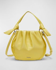 "Find ORYANY Selena Leather Bucket Bag on Editorialist. The Oryany Selena bucket bag is crafted from leather. It features a top handle and an adjustable crossbody strap. The bag has an open top with a magnetic closure. It has one zip pocket inside. The lining is made of polyester. The bag measures approximately 8.2\"H x 9.2\"W x 5.7\"D." Spring Leather Hobo Bag With Adjustable Strap, Leather Hobo Bag With Adjustable Strap For Spring, Spring Leather Hobo Bag With Double Handle, Spring Soft Leather Hobo Bag, Leather Hobo Crossbody Bag For Spring, Leather Crossbody Hobo Bag For Spring, Spring Evening Leather Satchel, Spring Leather Hobo Bag With Detachable Strap, Leather Shoulder Bag With Round Handle For Spring