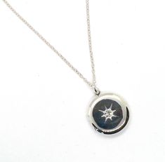 What a sweet & versatile locket to wear daily! This sleek 1950s working locket is plated in sterling silver. On the front of the locket is an atomic star setting with rays of engraved starburst coming from a centered Swarovski crystal rhinestone. The locket is 3/4" across and has 2 places inside for a photo, memory, intention, or whatever you want! This locket is smooth on the back and hangs from an 18" silver plated fine chain. Wear this beauty alone or layer it with your other favorite necklac Bouquet Locket, Vintage Locket Necklace, Star Setting, Locket Necklace Vintage, Vintage Locket, Gold Heart Locket, Gold Locket Necklace, Silk Purse, Photo Gold