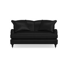 a black couch with two pillows on it