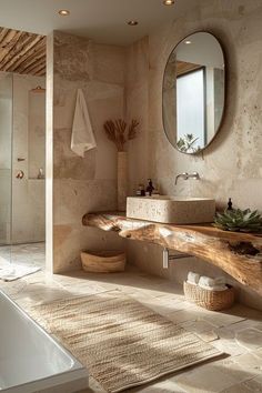 a bathroom with a sink, mirror and bathtub next to a large wooden bench