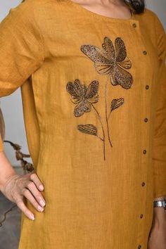 Mustard yellow linen kurta with floral embroidery.
Component: 1
Embroidery
Neckline: Round
Sleeve Length: Three quarter
Fabric: Pure linen
Color: Yellow
Front buttoned Soft hand feel Sustainable and eco-friendly product Note: The pants worn by the model is not for sale - Aza Fashions Embroidery Neckline, Linen Embroidery, Kurta For Women, Buy Linen, Linen Color, Pure Linen, Soft Hand, Aza Fashion, Mustard Yellow