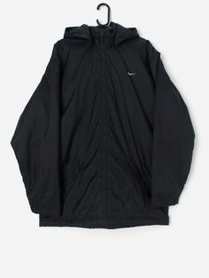 Vintage Nike coat with removable hood. This Y2K Nike coat features a large, thick hood that can be removed (zip). This coat also features a full length zip closure,  two side pockets with zip closures and an inside pocket with a zip closure. The Nike tick is on the front left and is also featured on the back of the jacket. Made from a heavyweight nylon with a nylon lining and a polyester fill.  Our recommended size: Large  Label says: Large  Condition: Good. Tarnishing on the zips. Please see la Nylon Hooded Jacket With Ykk Zipper, Cold Weather Hooded Raincoat With Double-lined Hood, Hooded Outerwear With Zip Fly For Streetwear, Winter Streetwear Parka With Ykk Zipper, Urban Hooded Outerwear With Ykk Zipper, Hooded Windbreaker With Double-lined Hood For Cold Weather, Outdoor Hooded Jacket With Zip Fly, Hooded Outerwear With Ykk Zipper For Cold Weather, Urban Hooded Parka With Zipper Closure