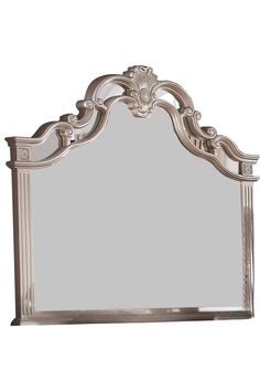 a white mirror with ornate carvings on the top and bottom frame, against a white background