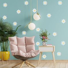 a living room with flowers painted on the wall and a chair in front of it