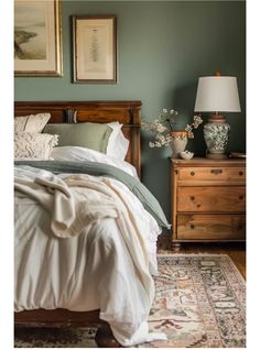 a bed sitting in a bedroom next to a wooden dresser and lamp on top of a rug