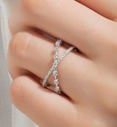 This 14k gold diamond stacking criss cross ring has round prong-set diamonds on two connected rings. Sparkles with every movement. You can also use it as a stacking or wedding band. Each piece is accompanied by an Azalea Certification and Warranty document, ensuring that you receive a high-quality, authentic piece of fine jewelry. Please message us if you don't receive your certification with your piece. This piece also comes with free engraving! M A T E R I A L & L E N G T H Available in 14k Yellow Gold, 14k Rose Gold, 14k White Gold, 18k Yellow Gold, 18k Rose Gold, 18k White Gold and Platinum. Please message us for 18k gold and Platinum prices. Band width:  12 mm Stone: Natural Diamonds Diamond sizes: 1 mm and 1.5 mm Carat Weight:   0.35 ct. tw. Color: G Quality: SI-VS Additional Notes: Elegant Cross-shaped White Gold Ring, Elegant White Gold Cross Ring, Elegant Diamond Cross Ring, Elegant Cross-shaped Diamond Rings, Elegant Cross Ring For Anniversary, Elegant Cross Rings With Diamond Accents, Elegant Cross-shaped Promise Ring, Diamond Accented Cross Promise Ring, Cross Shaped Promise Ring With Diamond Accents