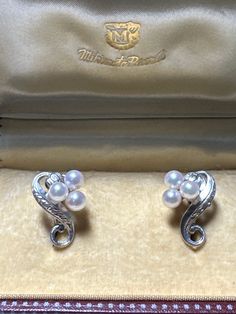 Vintage Mikimoto pearl screw back earrings.  Six cultured Akoya pearls, 4.5mm each, with excellent luster and pink undertones are set in sterling silver in a floral theme.  The pearls are the flowers at the end of the stem. Sterling silver is beautifully engraved and catches the light for an additional sparkle! Earrings are hallmarked with the Mikimoto cartouche and the word silver. These earrings would make a wonderful gift for that special woman. Consider your mother, aunts, friends, or even y Refined Akoya Pearl Earrings As Gift, White Gold Clip-on Pearl Earrings Fine Jewelry, White Gold Clip-on Pearl Earrings, Refined Akoya Pearl Earrings For Formal Occasions, Elegant Pearl Clip-on Jewelry, Refined Silver Pearl Earrings For Gift, Timeless Akoya Pearl Earrings For Anniversary, Refined Sterling Silver Pearl Earrings For Formal Occasions, Elegant Akoya Pearl Earrings For Anniversary