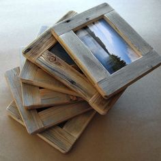 a stack of wooden frames sitting on top of a table