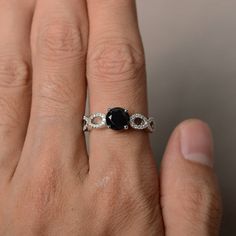 This is a gorgeous handmade creation. Its beauty is its simplicity & Elegance. The 7*7 mm round shape faceted natural Black Spinel is crafted in solid sterling silver and with rhodium plated. Main stone weight about 1.65 ct. cz as accents. All item is sent in a beautiful gift box If you have any idea of design your ring,pls contact me directly. You can realize more lovely stuff clicking the link https://www.etsy.com/shop/knightjewelry?refshopsection_shophome_leftnav Please leave the correct Elegant Ethical Sapphire Promise Ring, Diamond Cut Sapphire Ring, Diamond Cut Round Sapphire Ring, Sapphire Ring With Diamond Cut, Black Sapphire Fine Jewelry Ring, Elegant Black Spinel Jewelry With Prong Setting, Elegant Black Spinel Diamond Ring As Gift, Round Sapphire Ring With Diamond Cut For Promise, Elegant Round Sapphire Ring