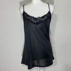 Free Kisses Black Camisole Tank Blouse Size: Large Color: Black Approximate Measurements Pit To Pit: 20in Length: 24in New With Tag Black Tank Top With Built-in Bra For Loungewear, Black Cami Top With Built-in Bra, Black Camisole With Built-in Bra For Loungewear, Black Stretch Camisole For Night Out, Stretch Black Camisole For Night Out, Flirty Cami Lace Top, Black Sleeveless Camisole With Built-in Bra, Sheer Stretch Camisole Top, Flirty Lace Cami Top