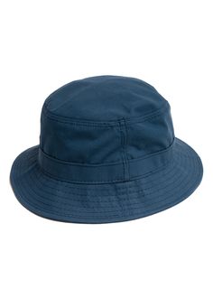 A breathable, but wind and water repellent accessory that quickly becomes both a rainy day and beach trip essential. Ventile is a premiere performance fabric. This Bucket Hat stays in stock each Spring-Summer for that exact reason. Available in Indigo and Olive for SS22 - with a few units in Navy still straggling from season’s past. Ventile fabric is woven in Switzerland from American grown and spun extra long staple (ESL) cotton, and the tightness of the weave makes it totally water repellent. Waterproof Outdoor Bucket Hat, Waterproof Casual Travel Hats, Casual Waterproof Hats For Travel, Casual Waterproof Travel Hat, Waterproof Short Brim Hat For Beach, Short Brim Waterproof Hat For Beach, Casual Waterproof Sun Hat With Curved Brim, Solid Waterproof Bucket Hat, Casual Waterproof Solid Color Sun Hat