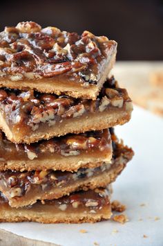 several pieces of pecan bar stacked on top of each other