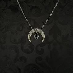 "This simple pendant features a richly detailed antiqued silver tone crescent, adorned with dazzling jet black glass crystals. Pendant is 1 1/8\" wide and 1\" tall.  Necklace length is adjustable with soldered stainless steel cable chain, lobster clasp and extender. If you would like a different length, please send us a message. Matching headpiece, pendant and earrings are listed separately in our store. If you don't see items with a color you want, feel free to ask about availability." Black Metal Jewelry With Moon Charm, Black Crescent Metal Jewelry, Black Metal Moon Shaped Jewelry, Black Metal Moon-shaped Jewelry, Black Metal Crescent Jewelry, Gothic Oxidized Pendant Jewelry, Black Crescent Metal Necklace, Mystical Black Metal Jewelry, Gothic Oxidized Jewelry For Halloween