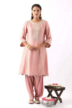 Blush pink A- line kurta in chanderi silk base featuring intricate dori and colorful thread embroidery on the neckline and sleeves. Paired with a salwar and scalloped organza dupatta with all-over floral booti embroidery. - Aza Fashions Pink Raw Silk Kurta With Dabka Work, Transitional Pink Tussar Silk Sets, Pink Raw Silk Kurta With Traditional Drape, Pink Dola Silk Kurta With Chikankari Embroidery, Pink Chikankari Embroidery Kurta In Dola Silk, Pink Chikankari Embroidered Kurta In Dola Silk, Designer Pink Tussar Silk Kurta, Pink Slub Silk Palazzo Set With Zari Work, Pink Dola Silk Kurta With Dori Work