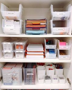 the shelves are organized with plastic containers and file folders