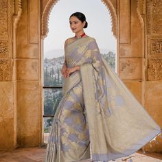 Introducing the stunning Steel Gray soft khaddi Georgette banarasi saree! This exquisite saree is crafted from the finest quality gray Georgette, with beautiful gold weaving and a pallu that is sure to turn heads. The fall and pico are perfectly done, and the matching blouse has been stitched so that you can unbox your saree and it is ready to go. Whether you are looking for something to wear to a special event or just want to treat yourself to a luxurious saree, this is the perfect choice. The Gray Traditional Wear For Festive Occasions, Gray Festive Traditional Wear, Festive Gray Traditional Wear, Semi-stitched Gray Traditional Wear With Zari Work, Gray Traditional Wear With Pallu, Traditional Gray Wear With Pallu, Gray Traditional Wear For Diwali, Gray Saree With Pallu For Festivals, Traditional Gray Dupatta With Traditional Drape