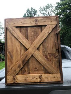 a large wooden door sitting on top of a table