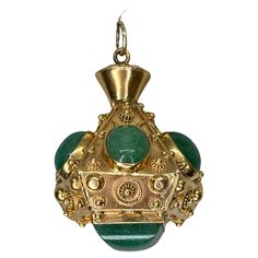 This vintage 18k gold Italian charm is encrusted with vivid green aventurine set among Etruscan Revival wirework and granulation. The ornate vintage piece was most likely first purchased at the Ponte Vecchio, a bridge in Florence famous for its jewelry shops and decadent baubles. The charm is oversized—the largest we’ve come across in this style. The unique 18k Gold Aventurine charm, fob, pendant presents timeless elegance of fine materials. Designed for the discerning collector who appreciates Green Aventurine, Pocket Watch, Florence, Jewelry Shop, Timeless Elegance, Jewelry Necklace Pendant, 18k Gold, Jewelry Necklaces, Necklaces