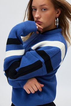 Retro-inspired BDG sweater in an oversized, slouchy fit. Designed in a midweight knit featuring a high stand collar, drop shoulder long sleeves and a ¼ zip front. Exclusively at Urban Outfitters. Features BDG Theo quarter zip pullover sweater Oversized ¼ zip sweater Midweight knit Stand collar with drop shoulder long-sleeves Quarter zip front Oversized, slouchy fit Cropped length Adjustable zip Easy pull-over style UO exclusive Content + Care 100% Acrylic Machine wash Imported Size + Fit Model i Trendy Blue Sweater For Cold Weather, Trendy Blue Outerwear With Crew Neck, Knit Sweatshirt For Streetwear, Knit Outerwear With Ribbed Cuffs For Streetwear, Oversized Blue Crew Neck Outerwear, Blue Oversized Crew Neck Outerwear, Trendy Winter Sweatshirt With Funnel Neck, Trendy Turtleneck Sweatshirt For Winter, Blue Winter Cardigan With Ribbed Cuffs