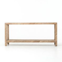 a wooden bench sitting on top of a white floor