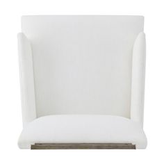 a white upholstered chair with wood legs and backrests, viewed from the front