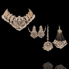 This majestic set has striking, intricate motifs and complex stone work, making it a stunning piece of handiwork! Gloriously enhanced with stone work, this set is one of the most extraordinary pieces in our collection. The set includes a necklace, a matching maang teekah, a jhoomar/passa and a pair of beautiful earrings. Approximate earrings length is 3.75". Gold-plated on high-quality brass as base metal. Made by order. Kindly allow 5-7 weeks for the delivery of this item. For custom or urgent Silver Kundan Set For Eid, Elegant Kundan Sets For Navratri, Eid Festival Gold Sets With Motifs, Elegant Kundan Necklace With Stone Work For Navratri, Temple Jewelry Kundan Chandbalis With Motifs, Festive Silver Kundan Set, Traditional Jewelry With Motifs For Navratri, Silver Kundan Sets For Festive Season, Silver Kundan Sets For Festive Occasions