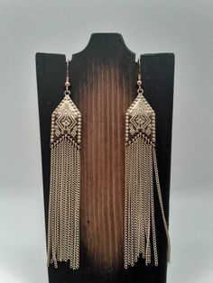 "If you're looking for a classy pair of earrings for work, a date night, or other event but don't want to spend a ton of money, than look no further. These gold plated earrings would go great with that little black dress, a casual work outfit, or your normal day to day clothes. Finished earrings measure 3\" long, will come with the pictured silicone backs and earring board, and will come enclosed in an organza ribbon gift bag." Elegant Metal Linear Earrings For Evening, Chic Silver Tassel Earrings For Party, Elegant Metal Tassel Earrings For Party, Elegant Silver Tassel Earrings For Evening, Metal Tassel Drop Earrings For Pierced Ears, Metal Tassel Drop Earrings For Party, Chic Metal Linear Earrings For Party, Elegant Silver Long Drop Tassel Earrings, Elegant Metal Linear Earrings For Parties