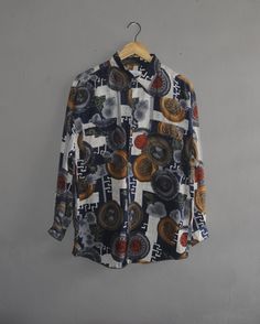 Cool Vintage Seaglen Abstract All over print button up shirt Used, show sign of wear, Overall in good vintage condition (Please refer picture) Shirt size Medium with actual measurement taken when lying flat armpit 22.5 inches and 29 Inches in total lenght (Approx) Shoulder to shoulder: 20.5 Inches Sleeve length from shoulder to cuff: 21 Inches Please note that vintage sizing is not the same as modern sizing. Always go by the measurements we provide and compare them to an item that fits you well. Vintage Patterned Printed Shirt, Vintage Buttoned Tops For Streetwear, Vintage Printed Patterned Shirt, Vintage Long Sleeve Printed Shirt, Vintage Multicolor Shirt With All Over Print, Patterned Graphic Print Button-up Shirt, Patterned Button-up Shirt With Graphic Print, Vintage Printed Button-up Shirt, Patterned Button-up Shirt With Vintage Print