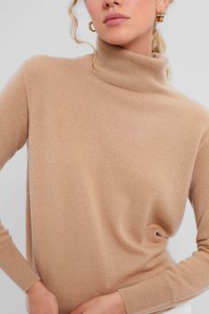 A cozy cashmere turtleneckPerfect for chilly days, this style is a true closet staple. With ribbed cuffs and a rolled turtleneck, it is as chic as it is comfortable. Pair with denim and ballet flats or a maxi skirt and boots!Our Favorite Details: Rib trim Relaxed fit Material: 100% CashmereCare: Dry clean Beige Fine Knit Winter Turtleneck, Winter Beige Fine Knit Turtleneck, Fine Knit Beige Turtleneck For Fall, Solid Cashmere Turtleneck For Workwear, Classic Winter Sweater In Neutral Color, Beige Soft Knit Turtleneck For Fall, Fall Beige Soft Knit Turtleneck, Classic Neutral Winter Sweater, Chic Beige Turtleneck For Winter